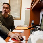 Tribal Councilman Ted Whitford sits at his desk in Rocky Boy Agency. Whitford is a member of the Chippewa-Cree Business Committee, which oversees businesses like Plain Green Loans, LLC. and the Northern Winz Casino.