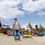 Patrick Legg stands in front all of the lawn care equipment he and his older brother Philip purchased in the past decade.  The brothers started Fire and Ice, a lawn care and snow removal business, when they were 8 and 10 years old.