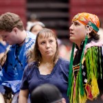 Philip, left, Monique and Patrick Legg prepare for the flag song at the 44th annual Kyi-Yo Pow Wow in Missoula. “I need to get in as many powwows as I can before my sons leave for their jobs,” Monique said.