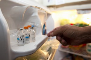 Jack Plumage reaches into his refrigerator to retrieve his insulin. A diabetes patient since 1984, he takes around a dozen pills a day to manage his health and keep his transplanted kidney functioning.