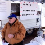 Elden White, vice president of the People’s Voice, gathers signatures for a petition outside Pablo Family Foods. The petition proposes a full payout to tribal members from the Salazar settlement.