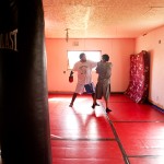 Alonzo BringsYellow and Sheldon Fisher spar in the Fighter’s Island gym. Fisher trains here almost every day, preparing for his title fight at the end of the month.