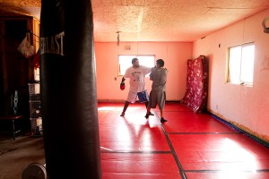 Alonzo BringsYellow and Sheldon Fisher spar in the Fighter’s Island gym. Fisher trains here almost every day, preparing for his title fight at the end of the month.