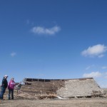 Julie Acheson and Angie Soper stand next to a fallen barn on Soper’s property in Glasgow, which is just outside the Fort Peck reservation. Acheson traded her 1,800-pound quarter horse, Ophelia, for the salvaged lumber and $1,500.