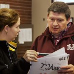 Tobacco Prevention Specialist Kati Antonich shows her T-shirt design idea to Gerald Gray, the tribal chairman, after a council work session in Great Falls. Gray's business, G+G Advertising, helps design most promotional items for the tribe.