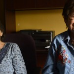 Louise Andrew, left, and Catherine Andrew, right, laugh while sharing a story about their youth. As children the sisters studied at the Ursuline Academy of St. Ignatius. They didn’t know very much English when they started. One day, Catherine’s teacher asked her to go check the time on the big clock in the hallway. Petrified, Catherine went to look. She came back and said the only number that she knew, “44.”