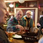 John Gysler, a hardware and furniture store owner in Wolf Point, dips into a bowl of peanuts and chats with regulars at Missouri Breaks Brewing while brewery co-owner Mark Zilkoski checks his iPad. Every Sunday afternoon after mass, Zilkoski, also known as “Doc'Z,” and his band play for a few hours in the lounge before moving to the taproom to finish off the evening.