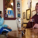Missouri Breaks Brewing co-owner Mark Sansaver jokes with a niece during a Friday afternoon visit to the Wolf Point pub. Sansaver works at the Fort Peck Community College business office handling grant funding and, because of limited mobility, rarely makes it to the pub.