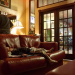 Below: Brewmeister Katie Zilkoski’s son Reed, 2, falls asleep in the brewery’s lounge area while his mother cooks spaghetti and meat sauce in an electric pot.  Customers of both venues may carve out an area for an afternoon nap, but where nodding out at Arlo’s gets you ejected, the brewery simply closes the lounge doors and the rest of the pub knows to enter quietly.