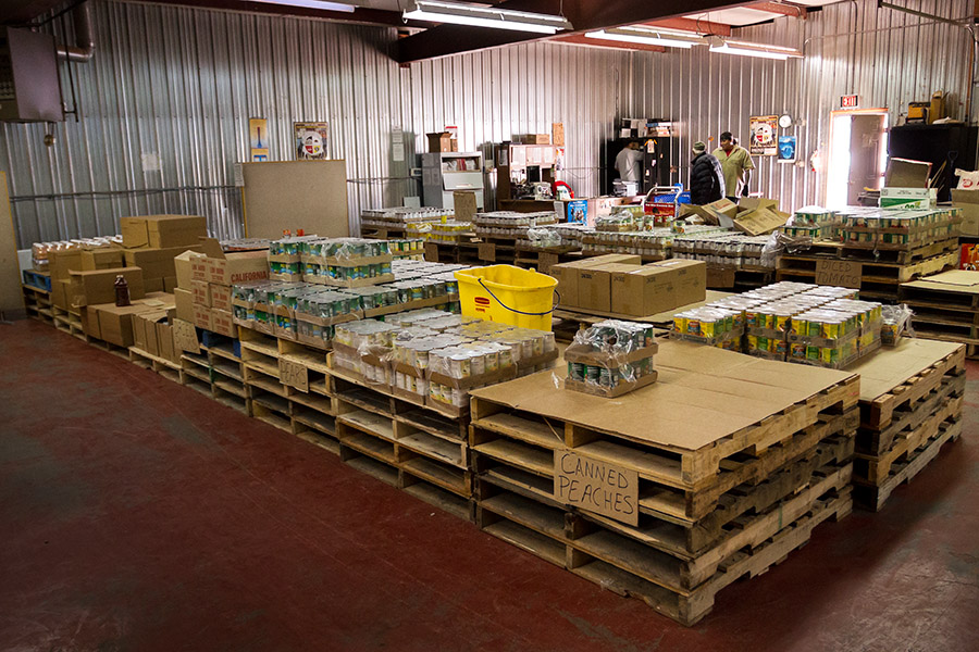 People who qualify for the commodity food program choose food for their families at the distribution center. Unfortunately, the food is sometimes not enough to last through the month.