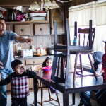 Roland Nez tries to get his kids ready for school before he drives to the Rocky Boy’s Indian Reservation. He is the sole adult probation officer for the Chippewa Cree tribe.