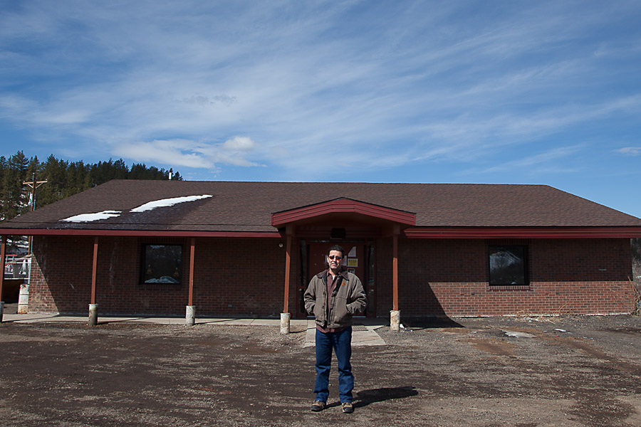 Major Robinson stands in front of the new Northern Cheyenne Utilities Center in Lame Deer. Robinson helped turn what was once a swimming pool changing room into a new facility for utilities workers. He also brought on many Northern Cheyenne tribal members in need of work to help remodel the building. 