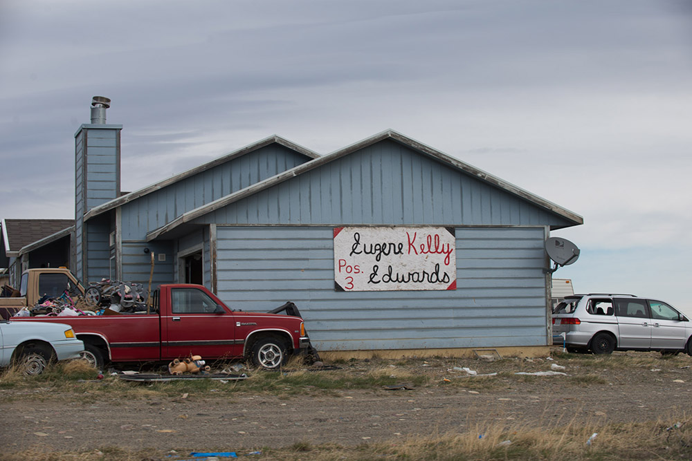 Members of the community hang campaign signs from their homes in preparation for the upcoming tribal election.