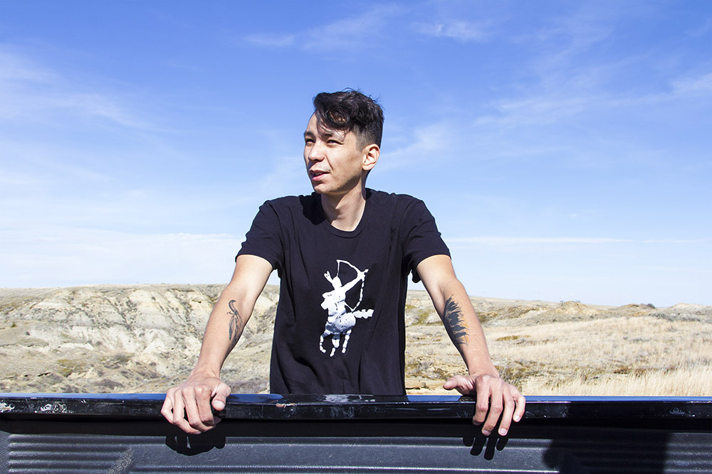 Francis Bauer rests on his brother’s truck after hiking through the badlands south of Poplar, Montana. Francis is an associate member on the Fort Peck reservation and cannot vote, own tribal housing or receive tribal handouts. “People think blood defines culture,” he says, “but blood is political, not cultural.”