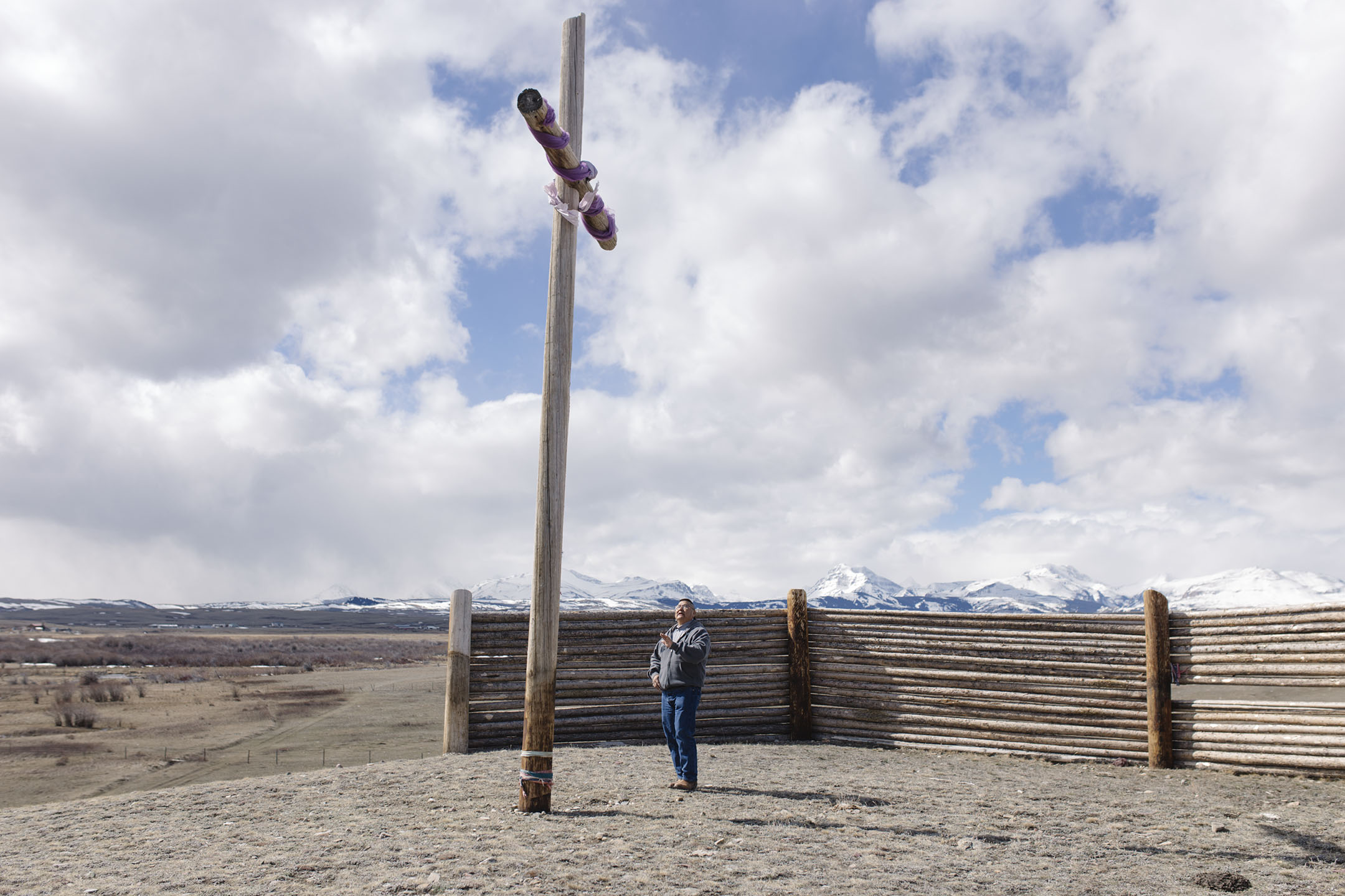 Reverend Calvin Hill stands at the cross on the apex of his property where his friend had a vision about creating a healing and recovery center.