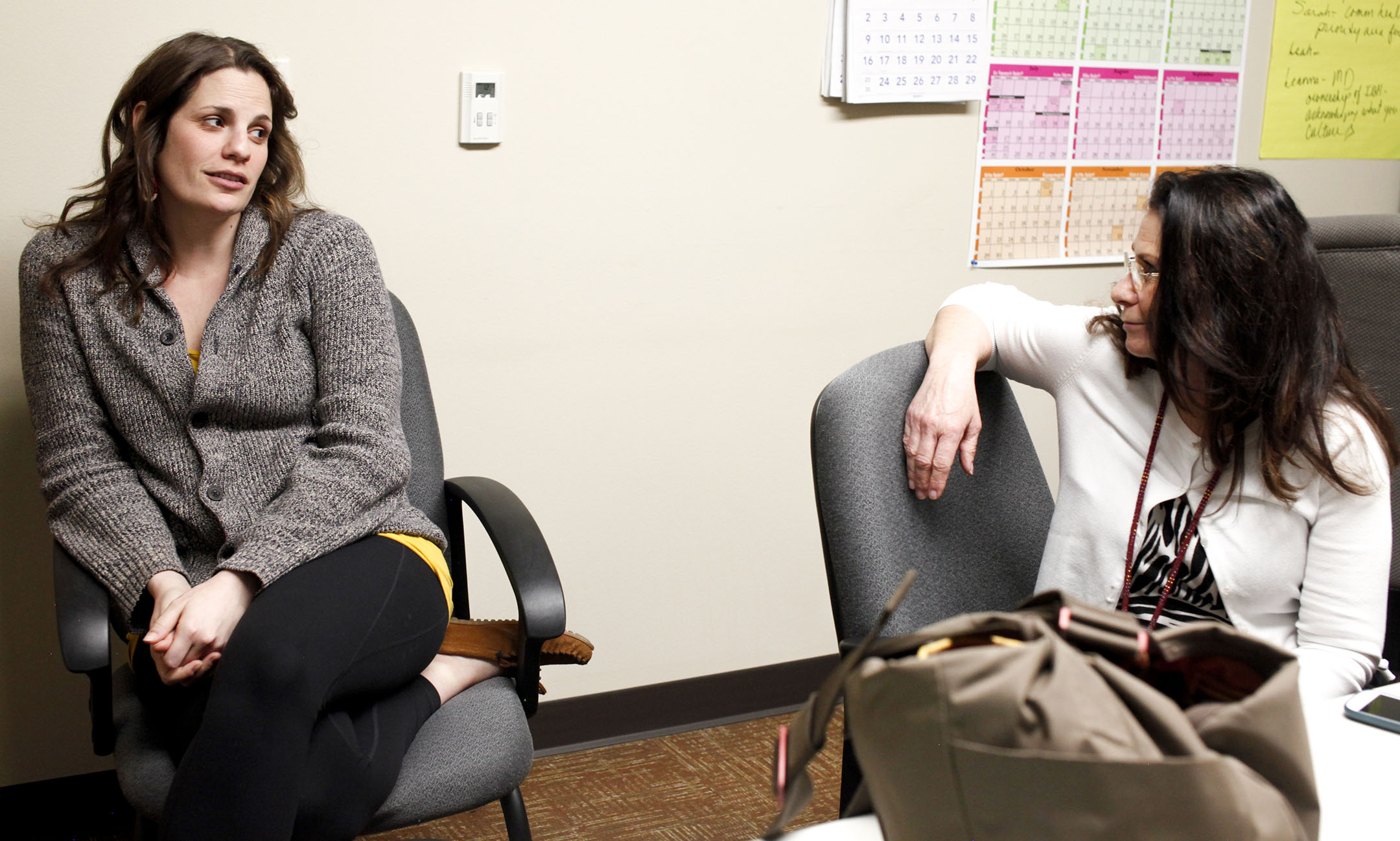 Tribal Health therapist and registered social worker Rosemary Epperson, left, talks with her colleague, Jerra Stuart. Eperson specializes in youth counseling and says there is a lot of stigma surrounding mental health on the Flathead reservation.