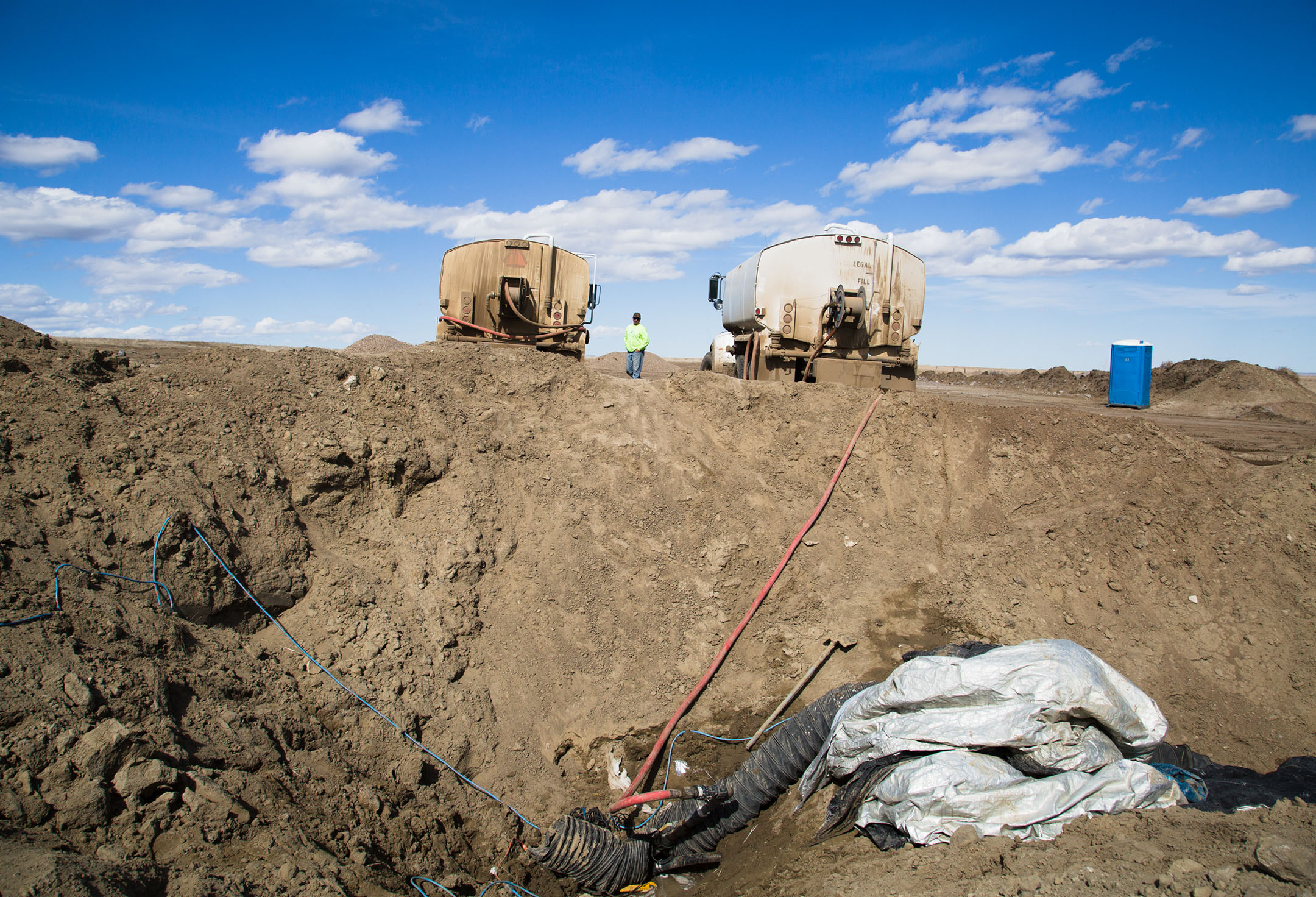 A Chippewa Cree Construction worker monitors water pressure at Lake Elwell. Water pressure tests are conducted to make sure there are no leaks in the system and to test the strength and integrity of construction.