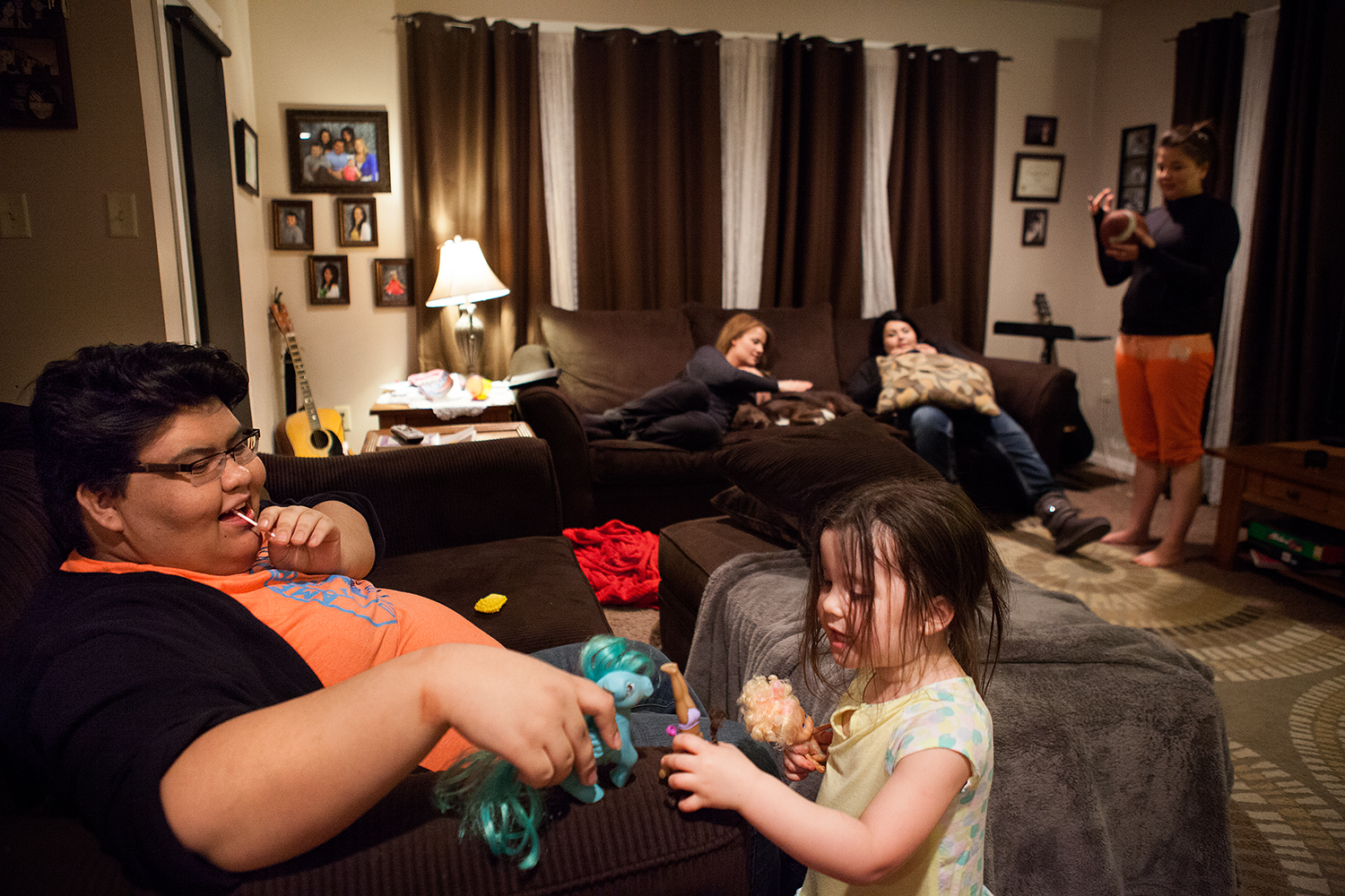 Dakota plays with his cousin in his aunt and uncle's house in Browning, Montana.