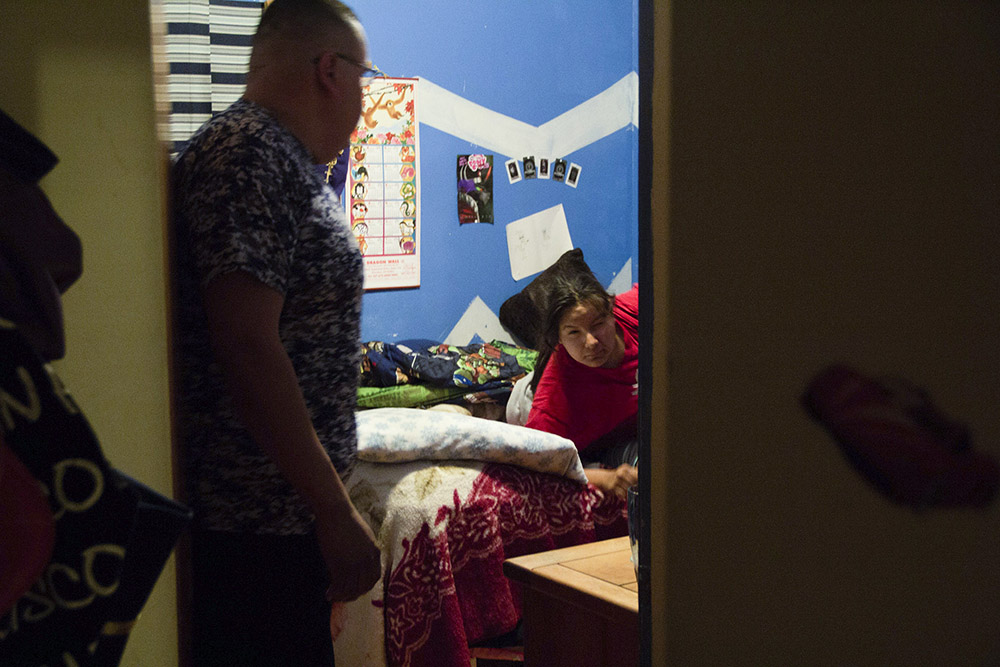 Sheldon King wakes his daughter, Shelby, for school at 5:30 a.m. Even though they live across the street from the school in Busby, King’s two children commute 40 miles each way to St. Labre Indian School in Ashland.