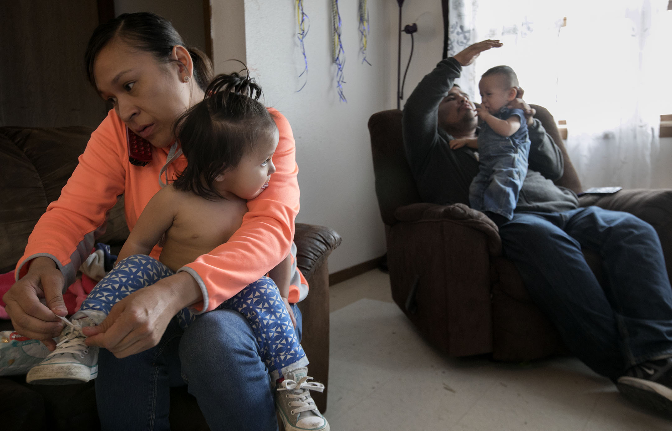 Jean and Donald Bear dress their twins, Hazel and Kale, for the day. When Jean Bear learned she was having twins, doctors referred her to Billings Hospital six hours away. She signed up for Medicaid which covered the travel, lodging and treatment costs of her prenatal care.