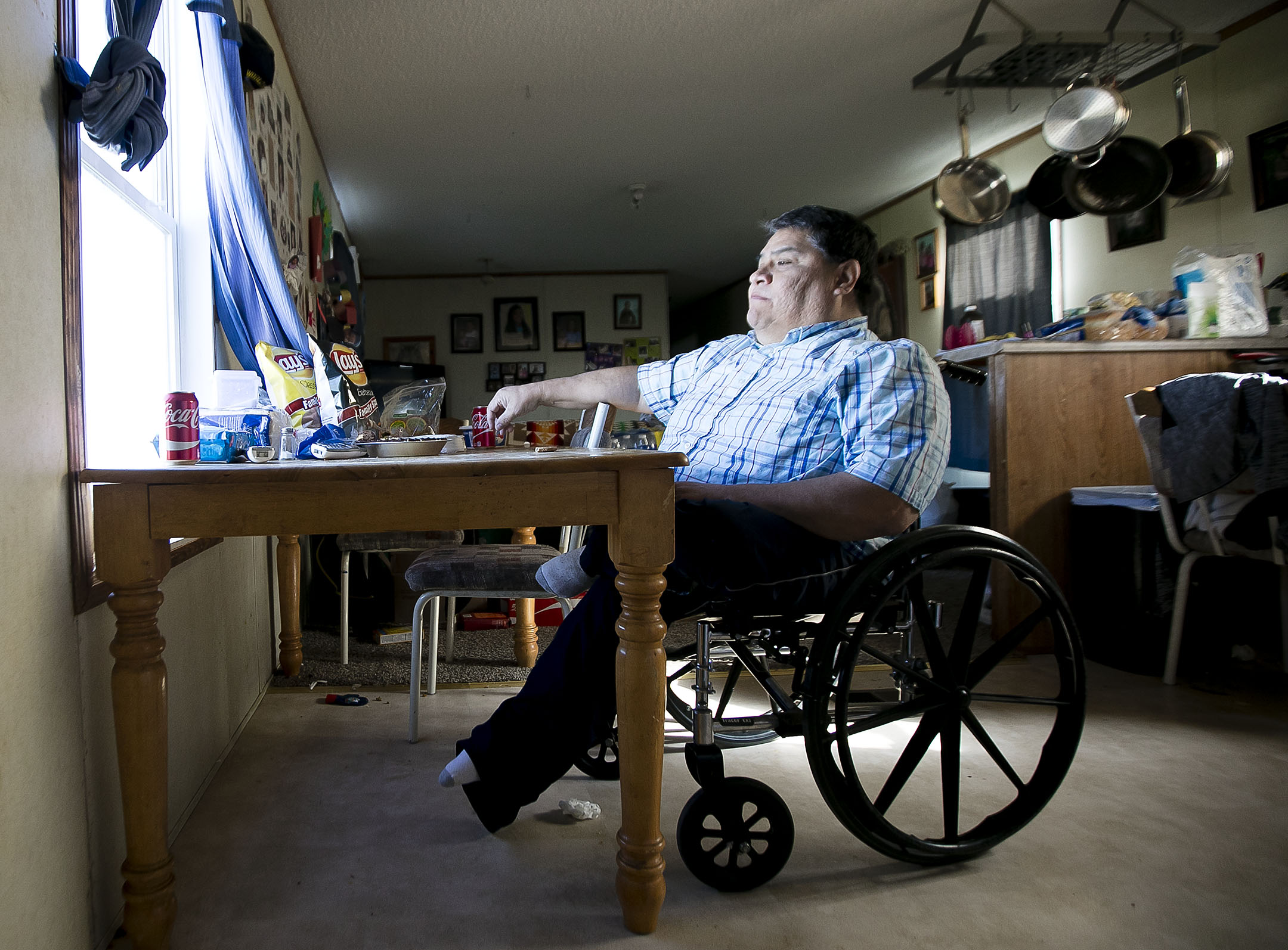 Kermit Horn sits at his kitchen table after Easter lunch and stares north toward the Milk River on the Fort Belknap Indian Reservation.