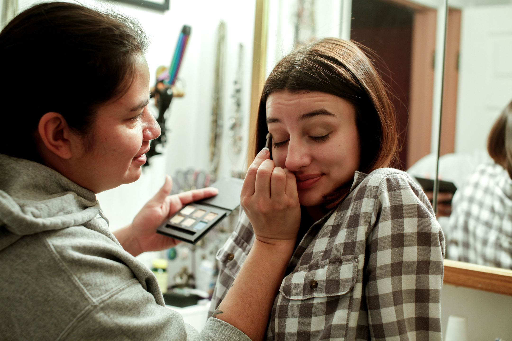 Annesha Anderson helps her daughter JaNessa put on makeup before school. JaNessa was diagnosed with clinical depression a year ago and says she couldn’t get out of bed most days without the help of her mom.