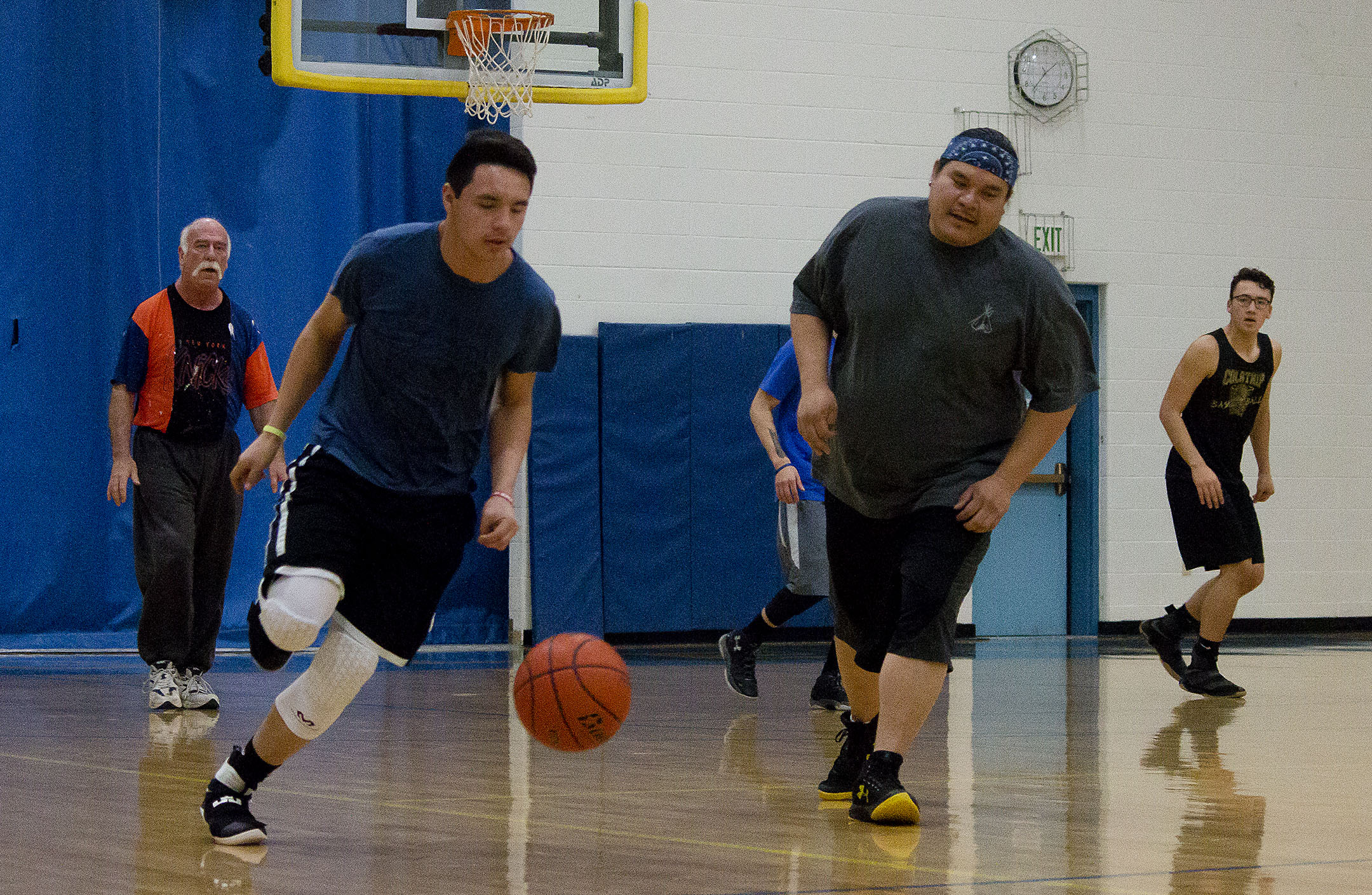 Killsback, right, says basketball is the favorite local pastime on the reservation. He wants to invest tribal resources into diabetes prevention through cultural and lifestyle changes.