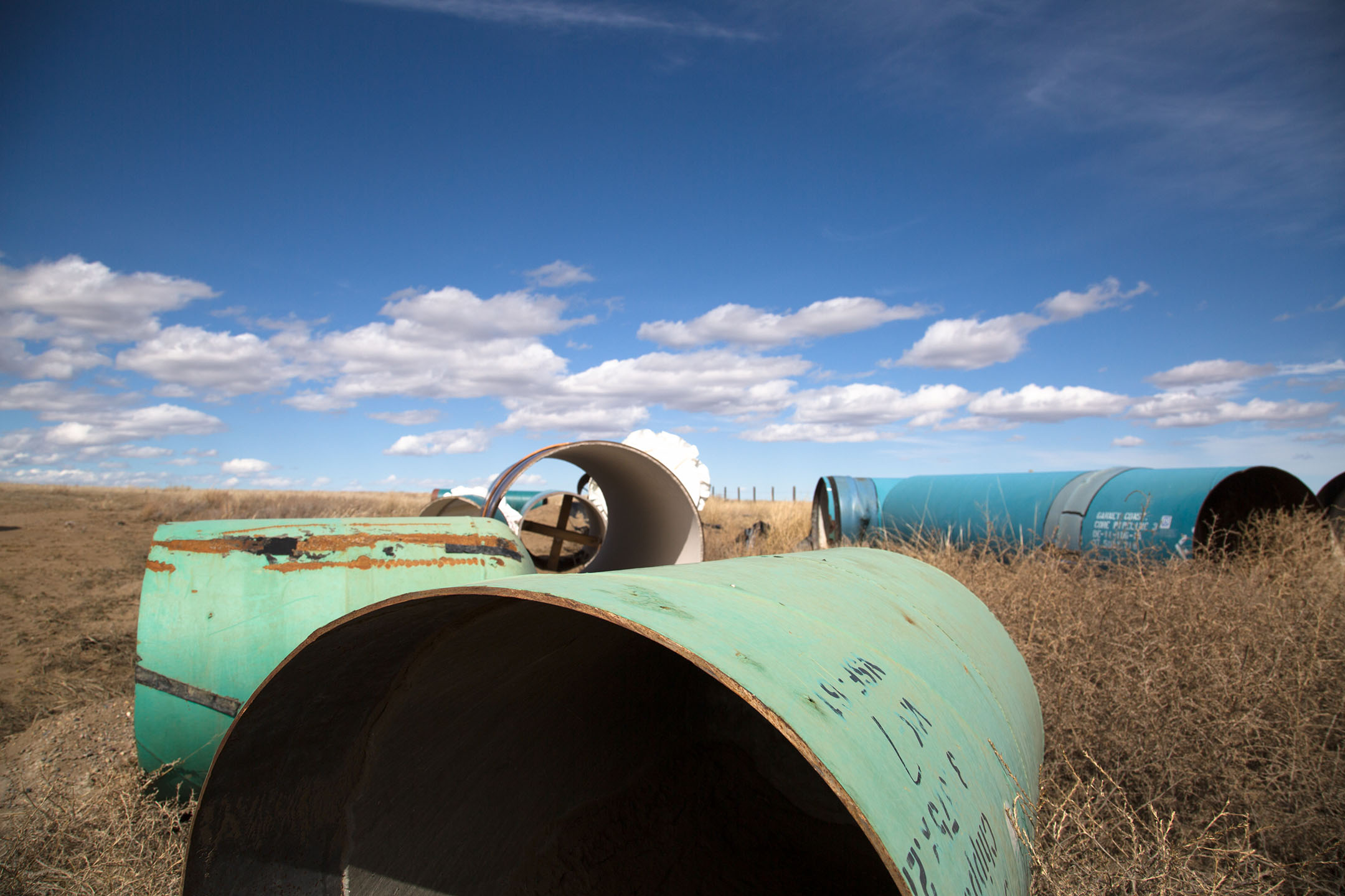 Steel pipes sit in a field above the Tiber Reservoir, also known as Lake Elwell. To date, 21 miles of pipeline have been completed of the approximately 54 miles needed to reach Rocky Boy’s Indian Reservation.